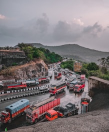 a group of trucks parked next to each other on a road