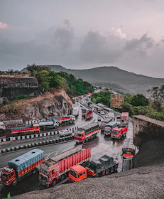 a group of trucks parked next to each other on a road