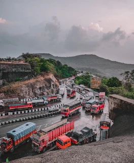 a group of trucks parked next to each other on a road