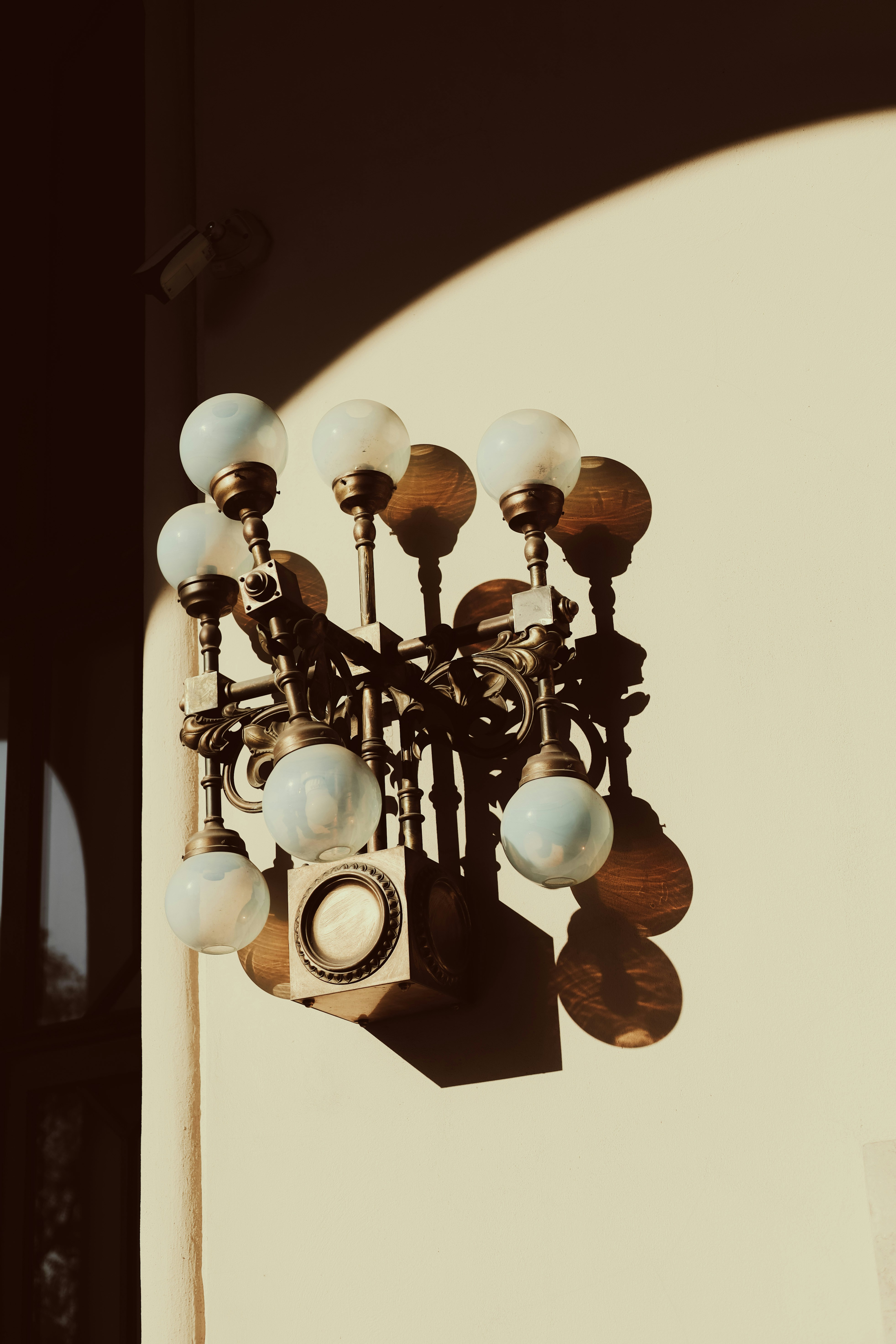 a chandelier hanging from the side of a building