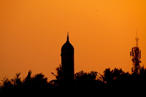 a tall tower with a clock on top of it