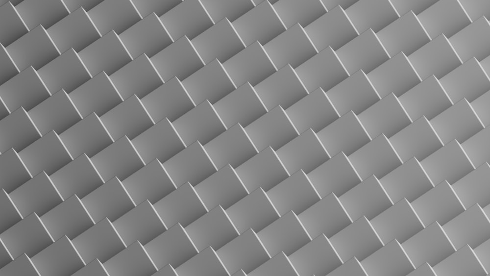 a gray background with a pattern of squares