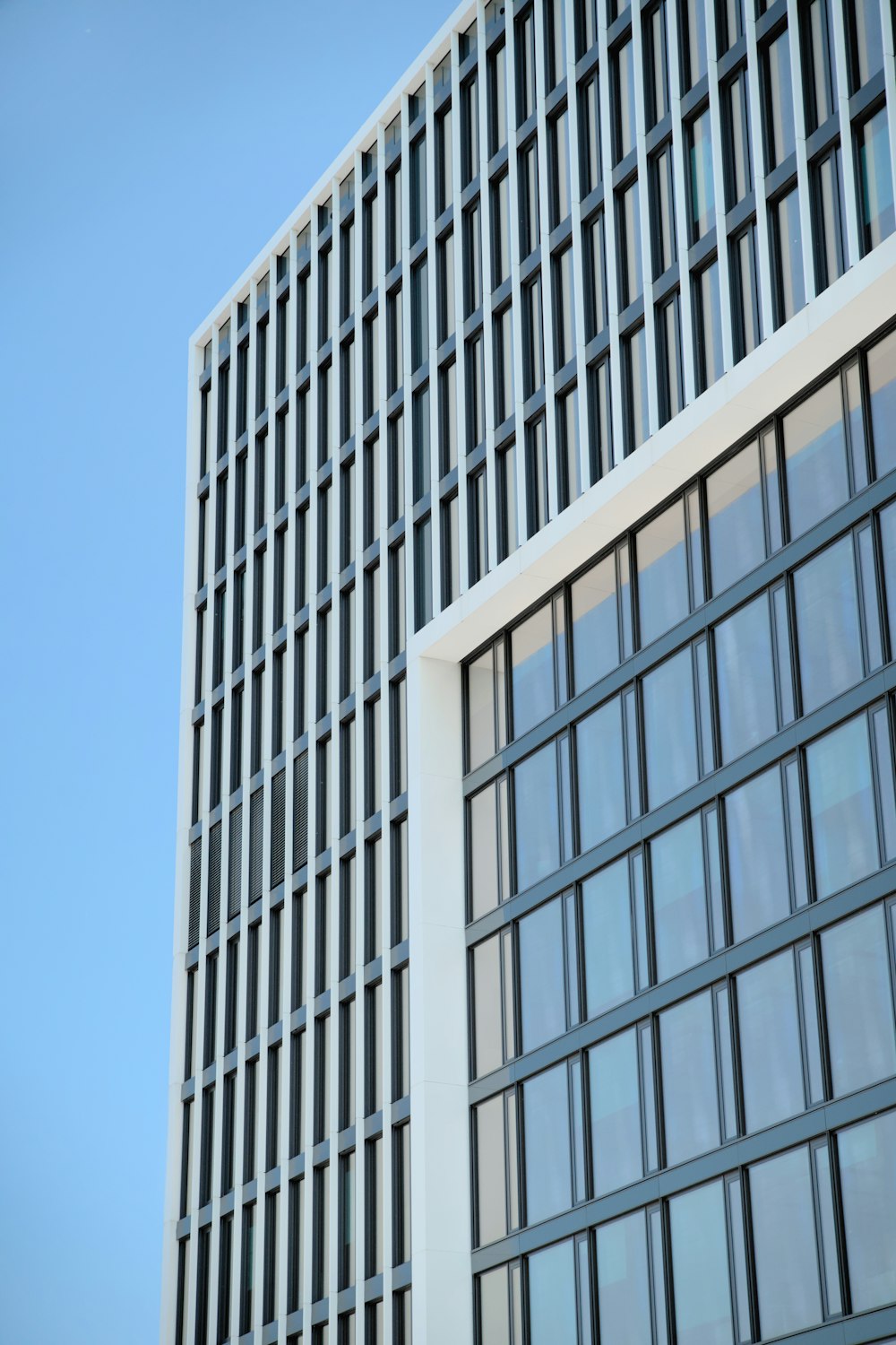 a tall building with a lot of windows next to it