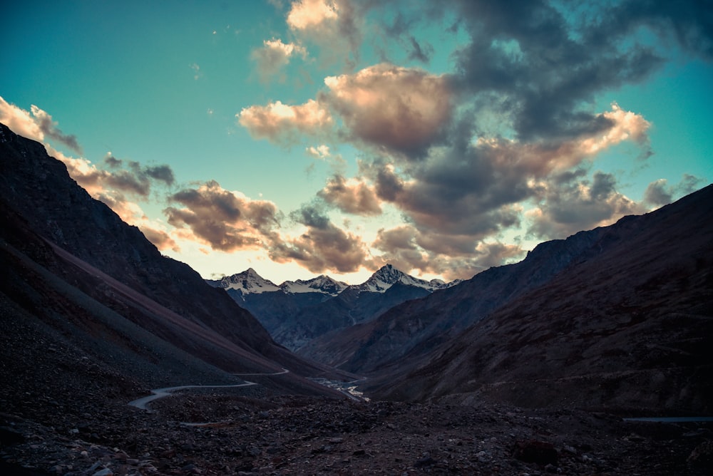 a view of a valley with mountains in the background