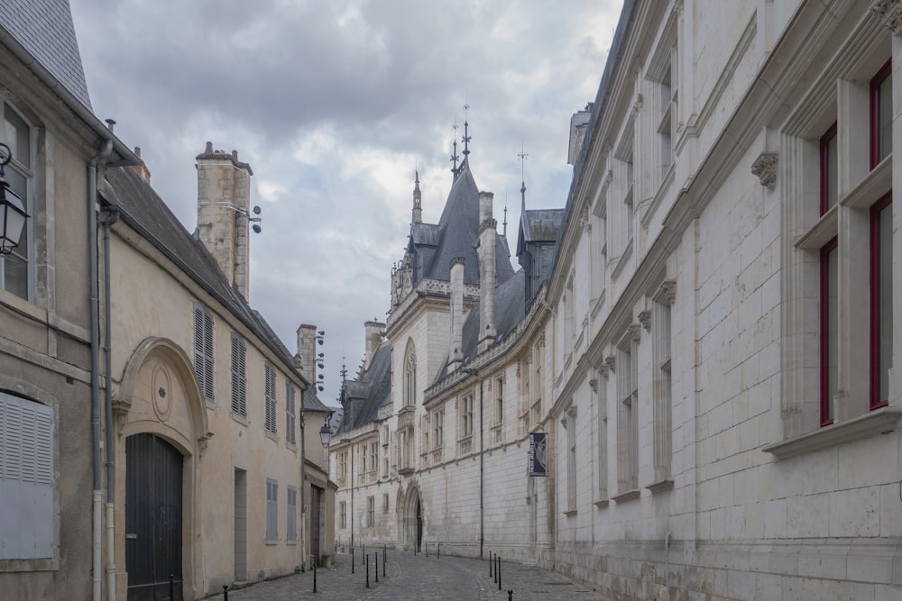 a cobblestone street lined with old buildings