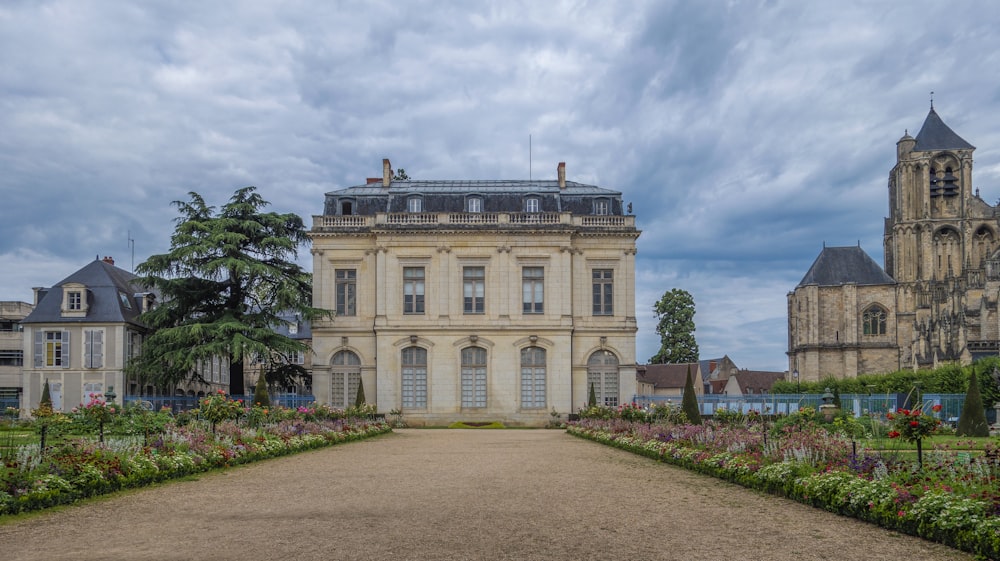 a large building with a garden in front of it