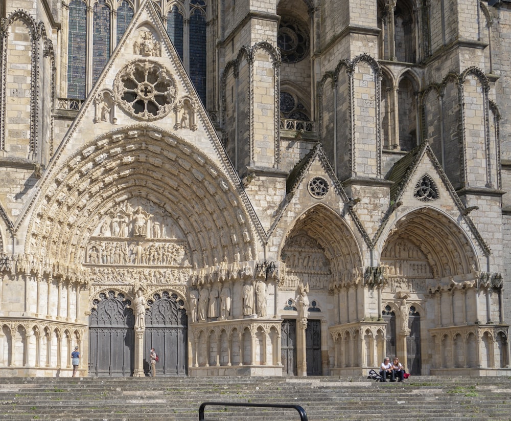 a large stone building with a clock on it's side