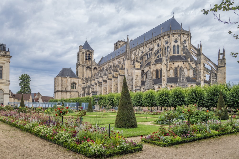 a large building with a garden in front of it