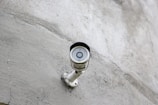 a security camera mounted on the side of a building
