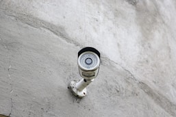 a security camera mounted on the side of a building