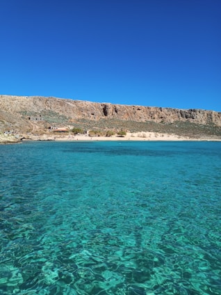 A scenic view of a beautiful Mexican beach with clear blue waters.