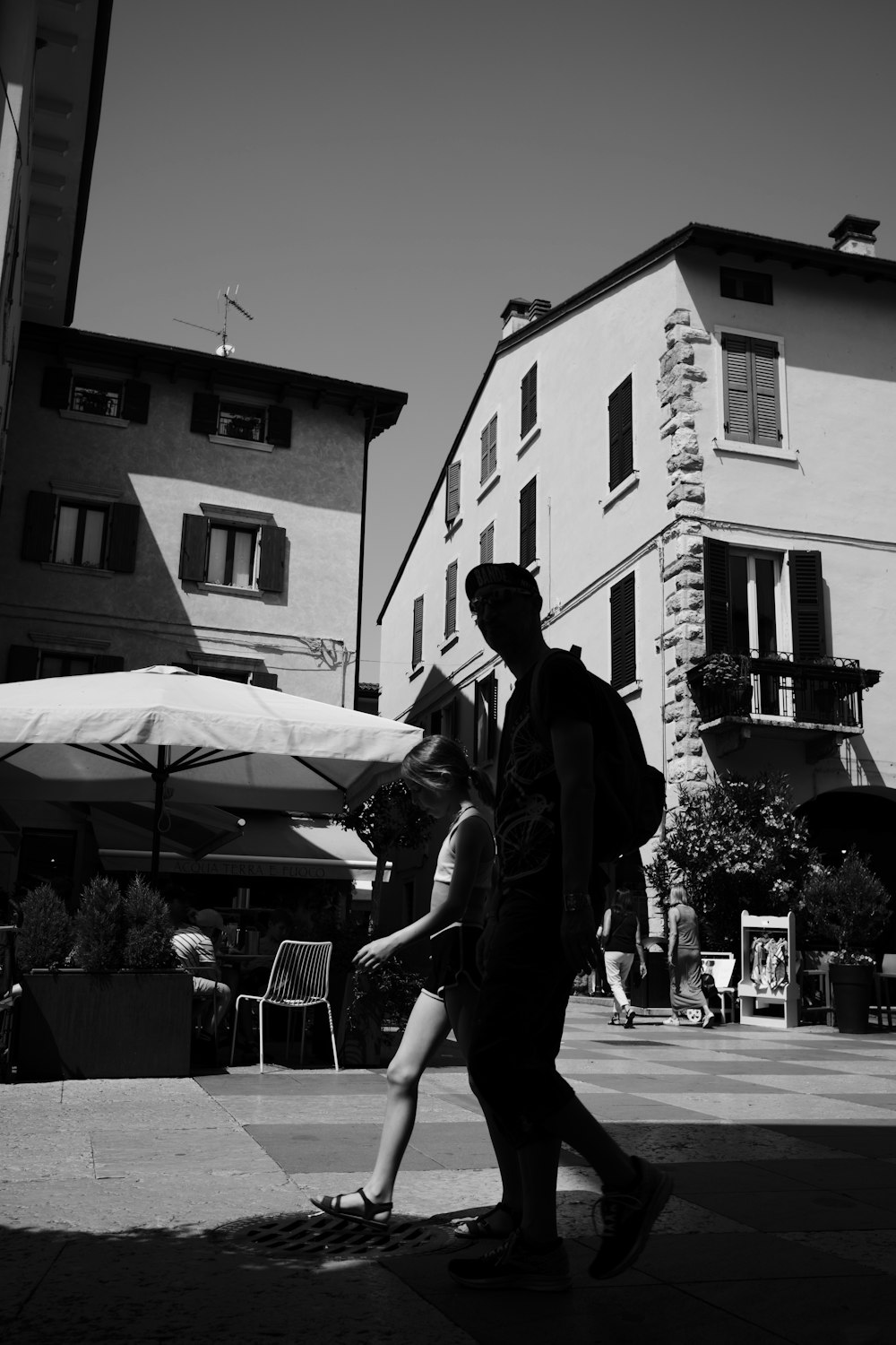 a man and a woman walking down a street