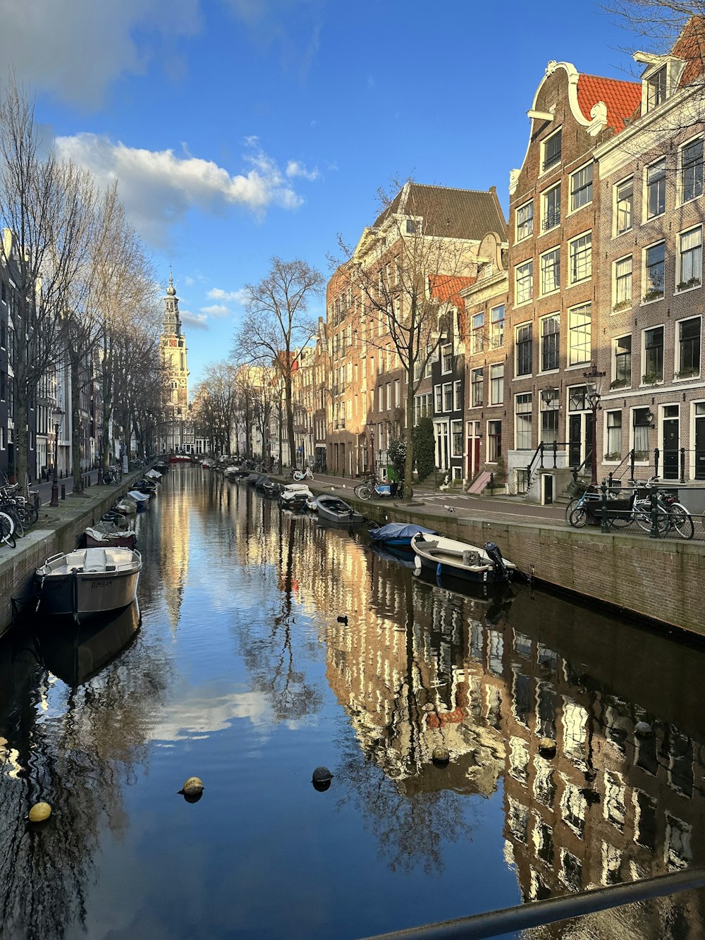 a river running through a city next to tall buildings