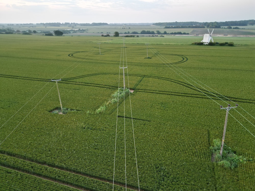 an aerial view of a field with wind turbines