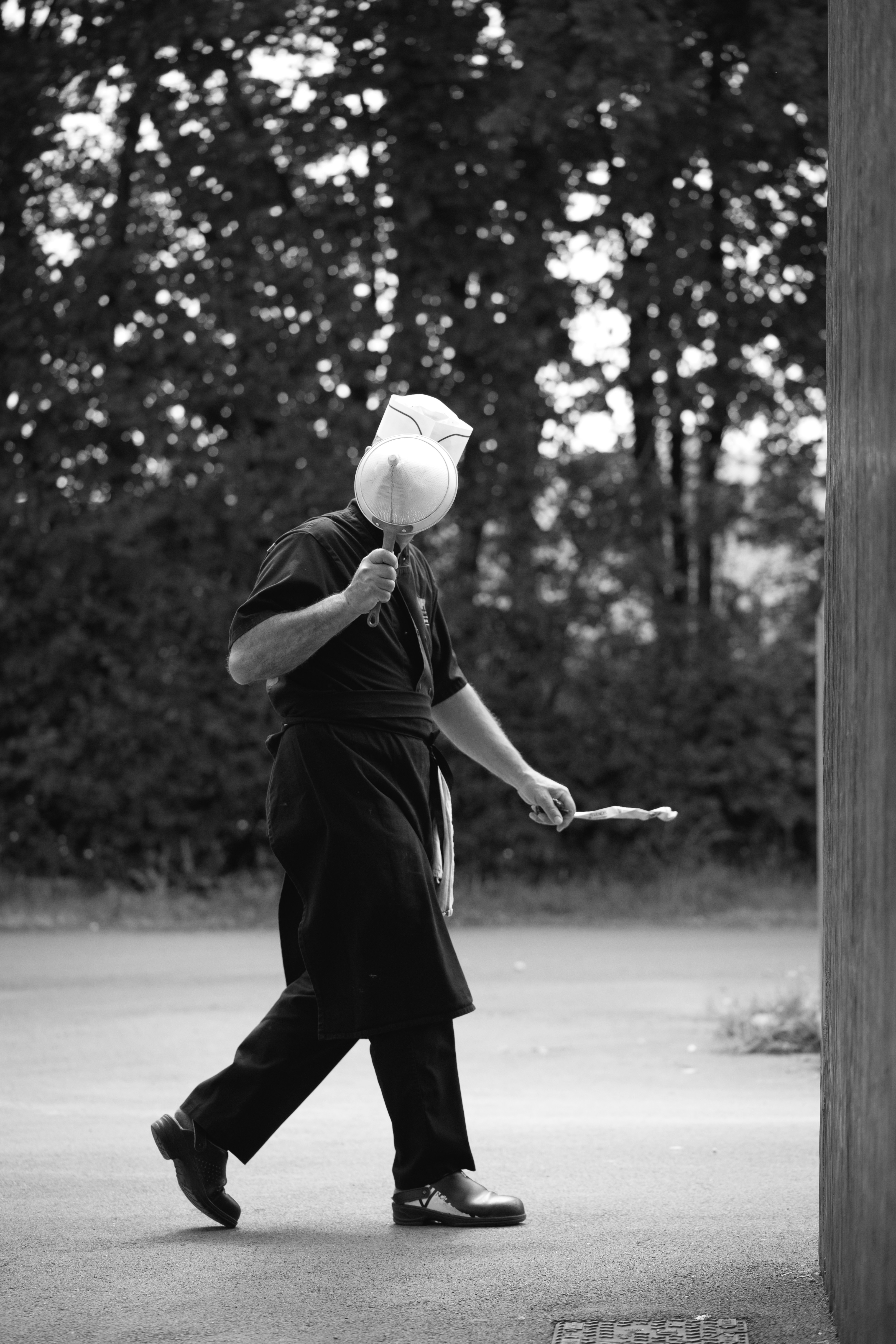 a man with a white hat is walking