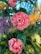 A vibrant and colorful bouquet featuring prominently pink roses, surrounded by purple and yellow flowers. The lush green foliage complements the blossoms, creating a lively and fresh floral arrangement.