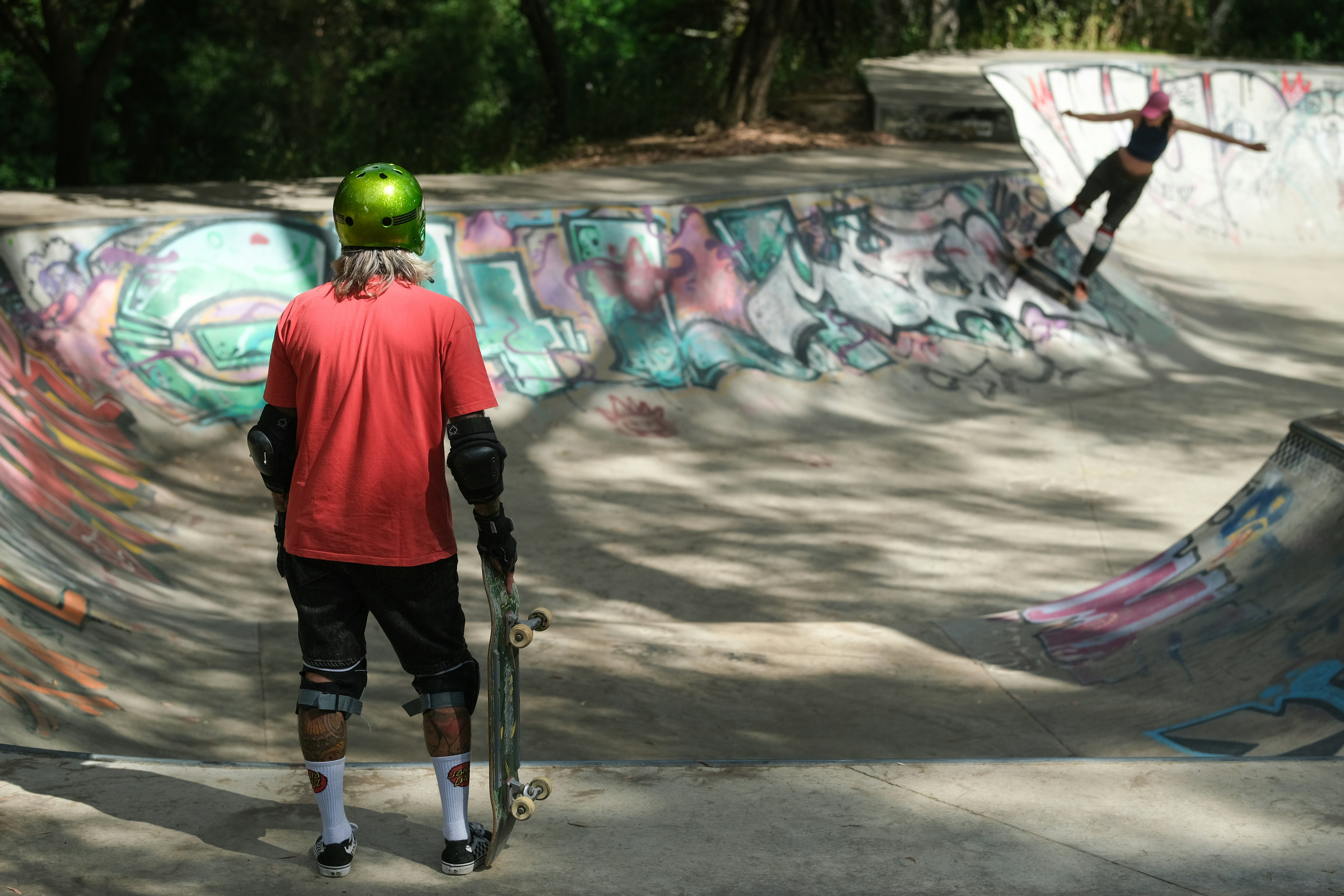 a man riding a skateboard up the side of a ramp