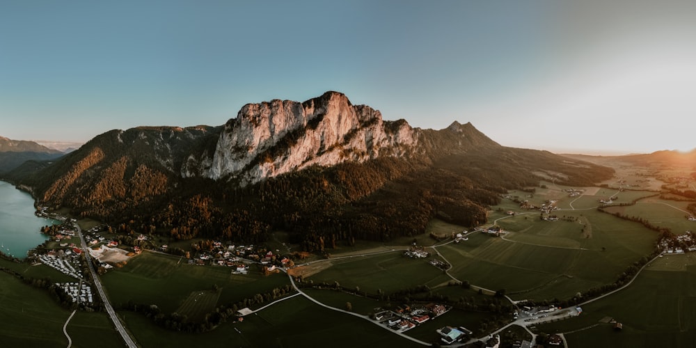 an aerial view of a lake surrounded by mountains