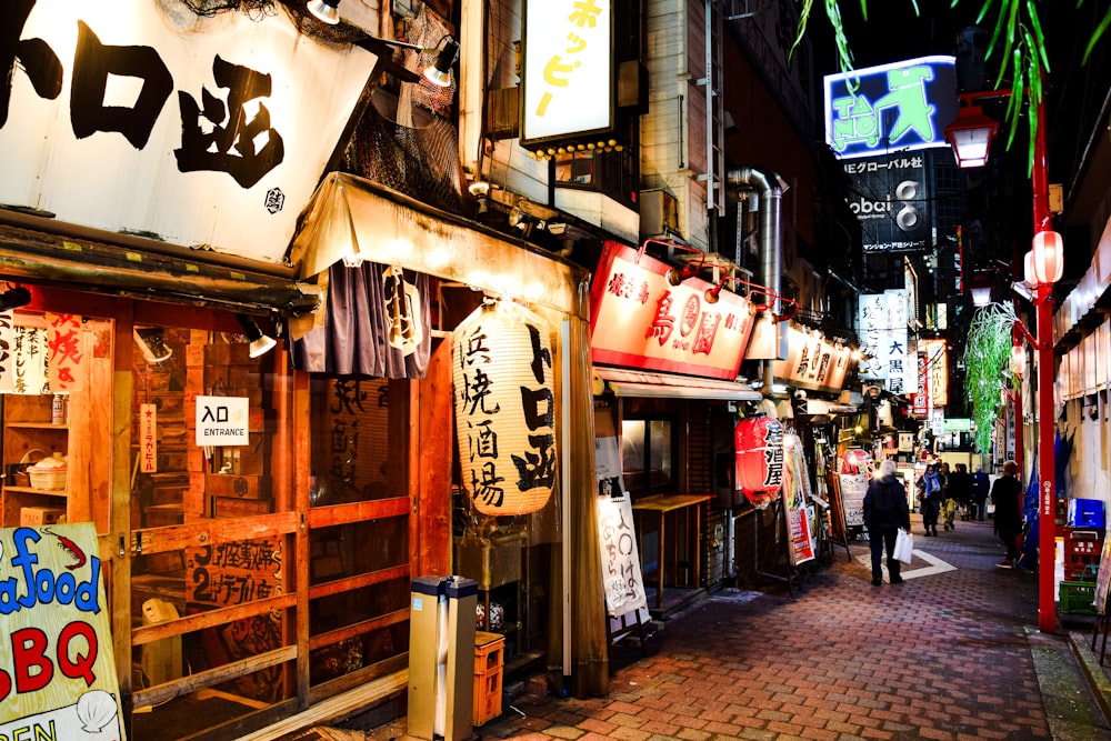 a person walking down a street in an asian city