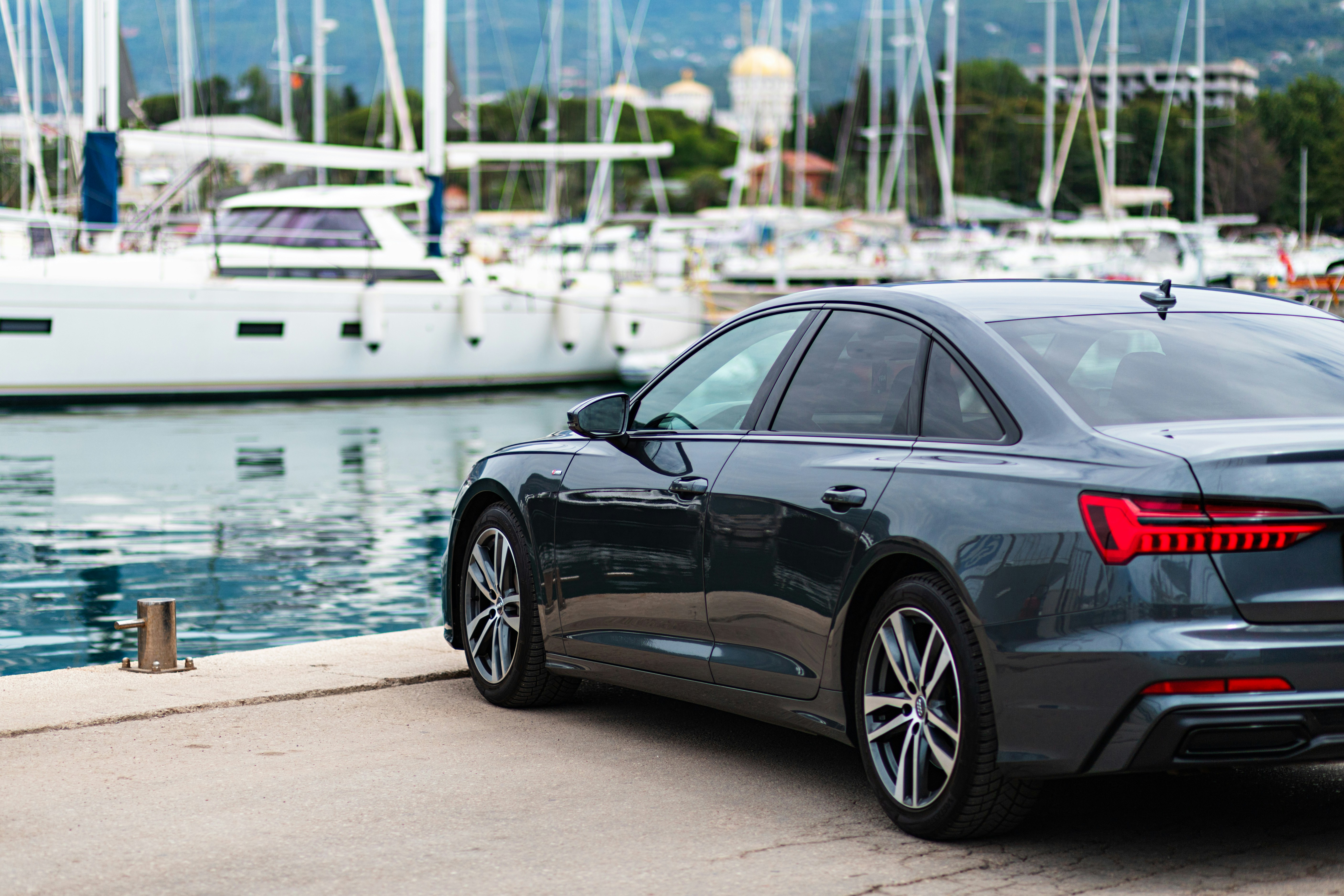 a car parked next to a body of water