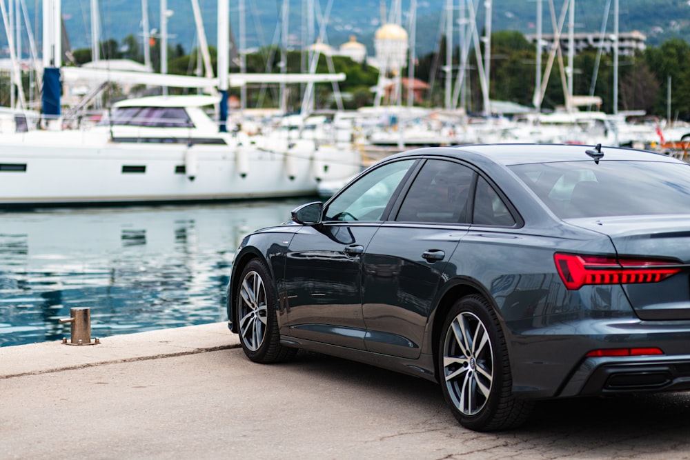 a car parked next to a body of water