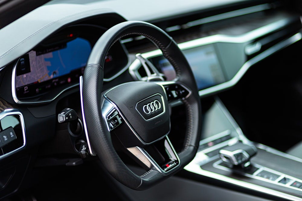 the interior of a car with a steering wheel