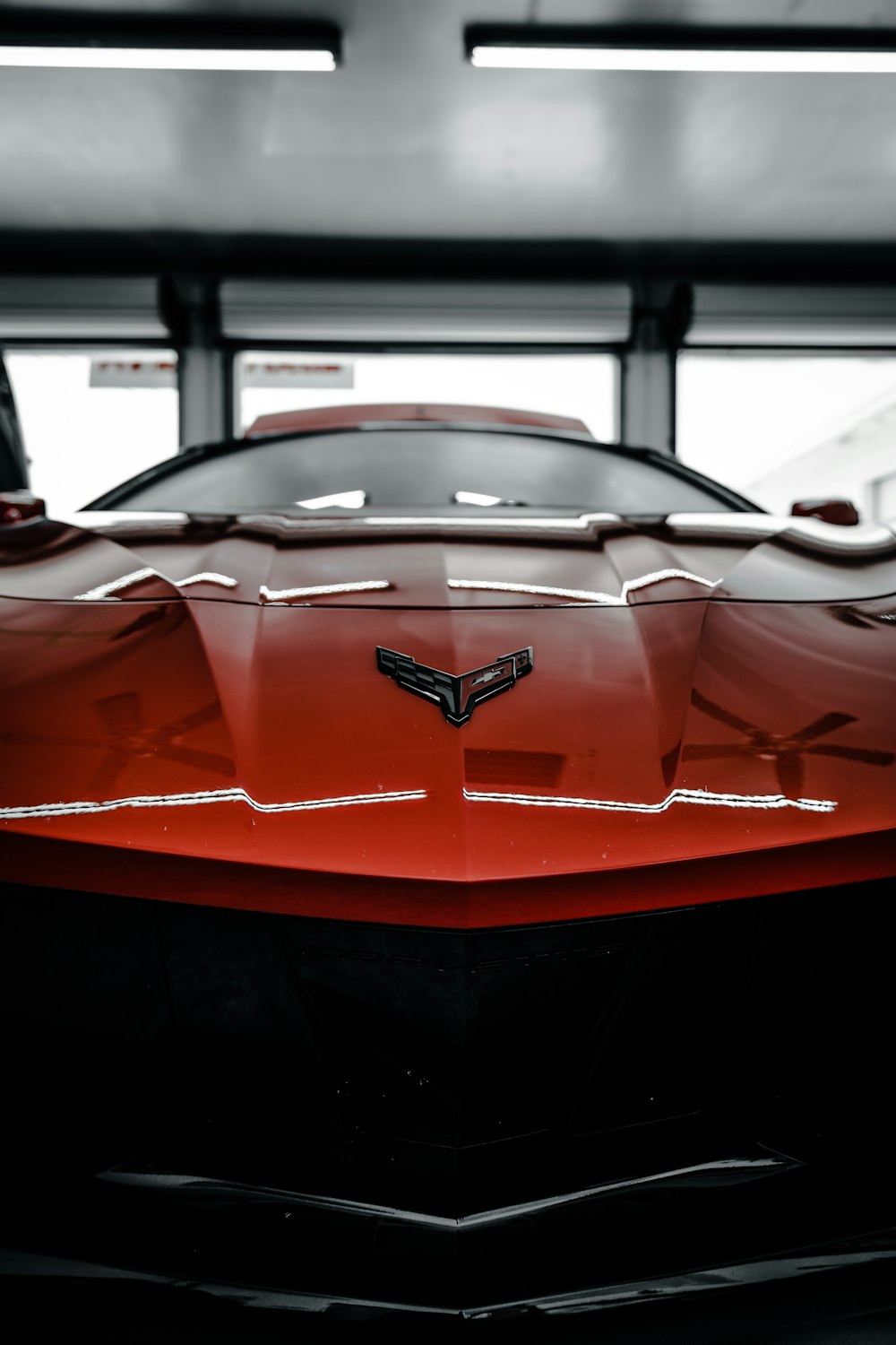 a red sports car parked in a garage