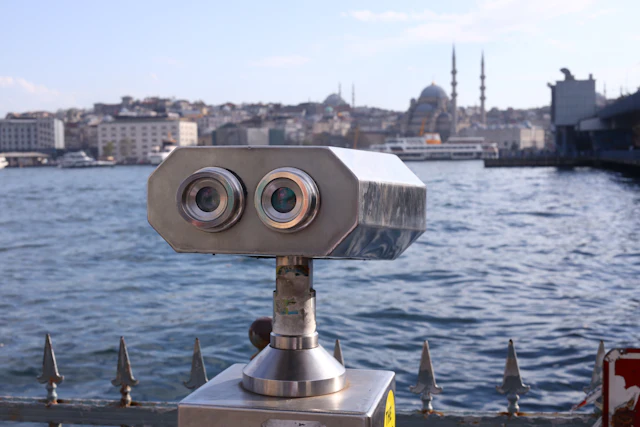 A coin-operated viewfinder on the Karaköy waterfront looks across the Bosphorus to the old city skyline.