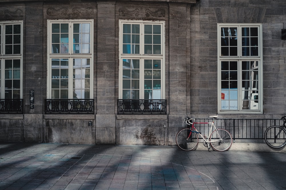 a bike is parked in front of a building