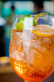 a close up of a drink in a glass on a table