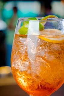 a close up of a drink in a glass on a table