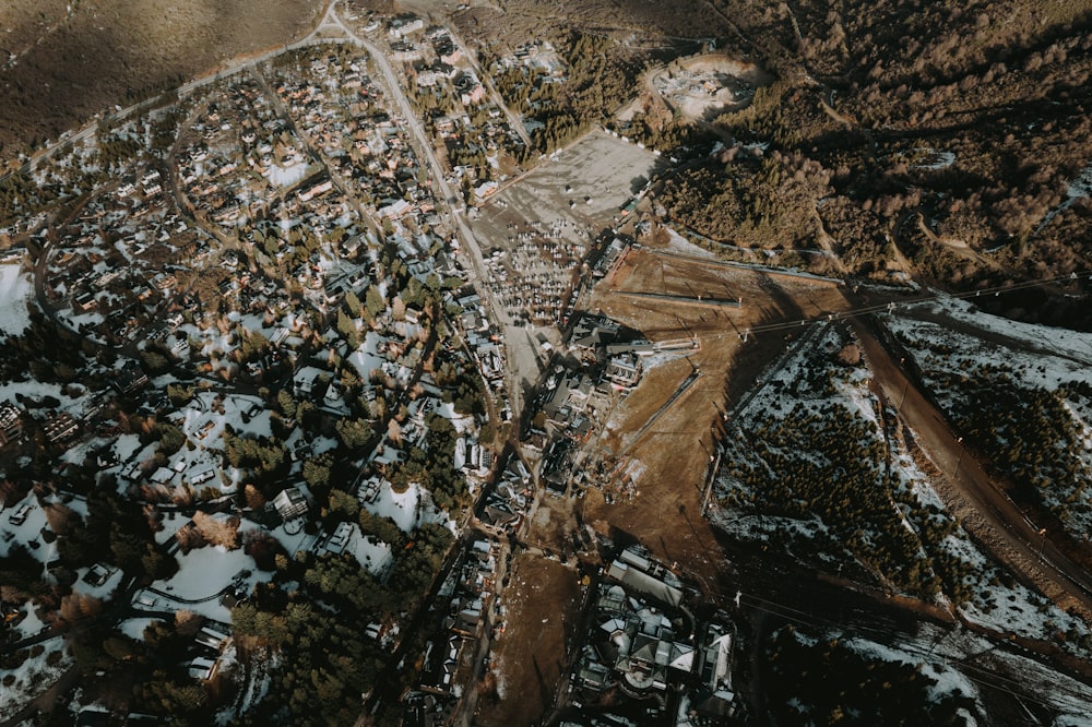 an aerial view of a snow covered village