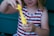 A happy child playing with vibrant, gooey slime from Slimey Delights LLC.