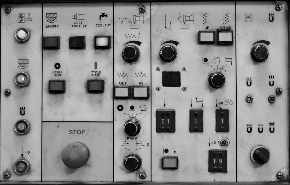 a close up of a control panel with buttons and switches