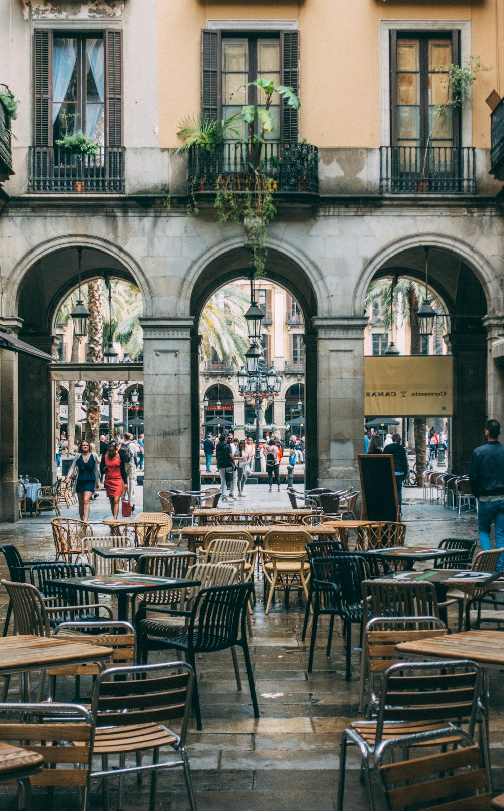 a group of tables and chairs in front of a building