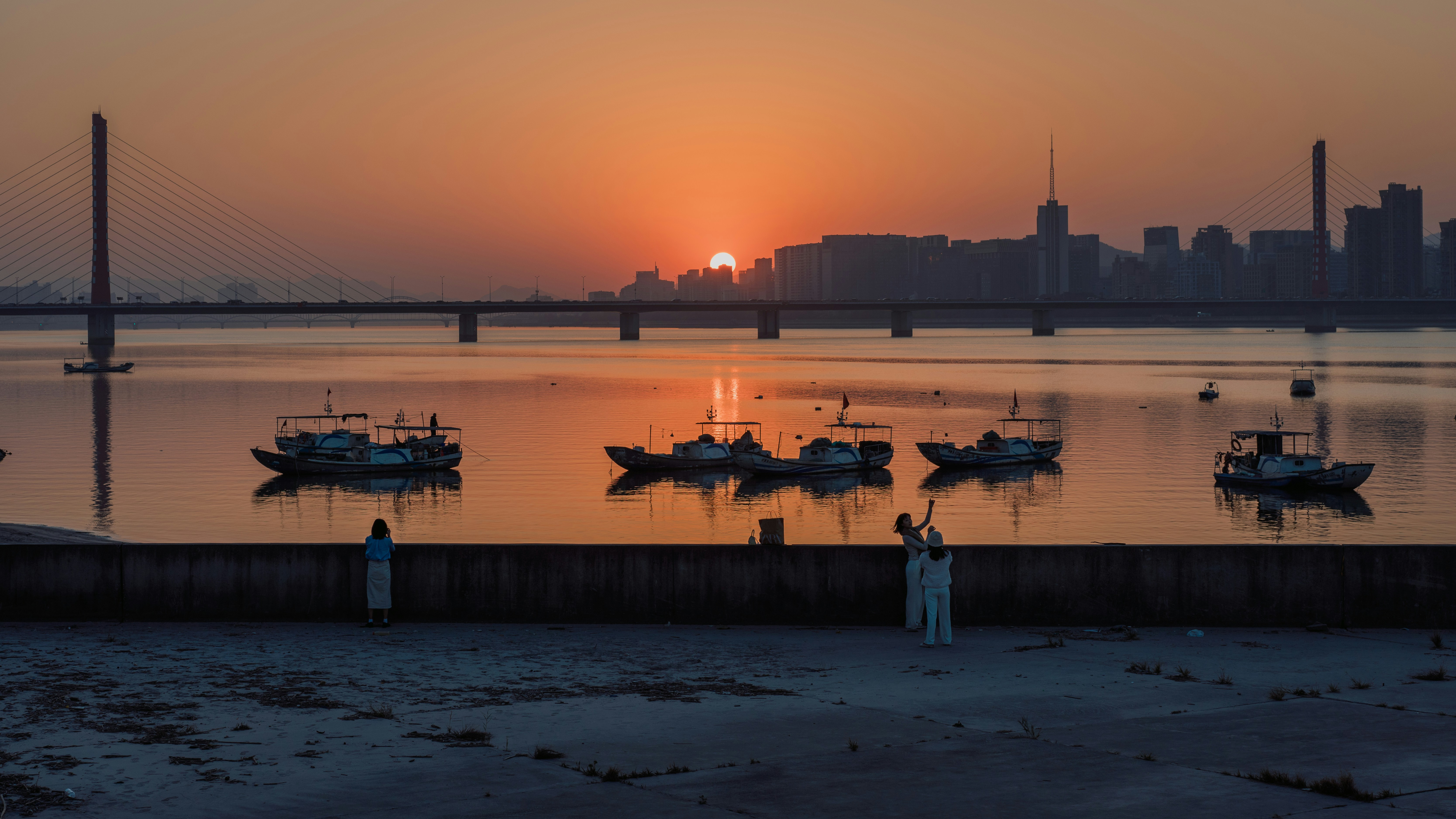 a couple of boats that are sitting in the water