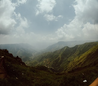 A panoramic shot capturing the peaceful landscape and rolling hills near the Wild & Woods Corbett project.