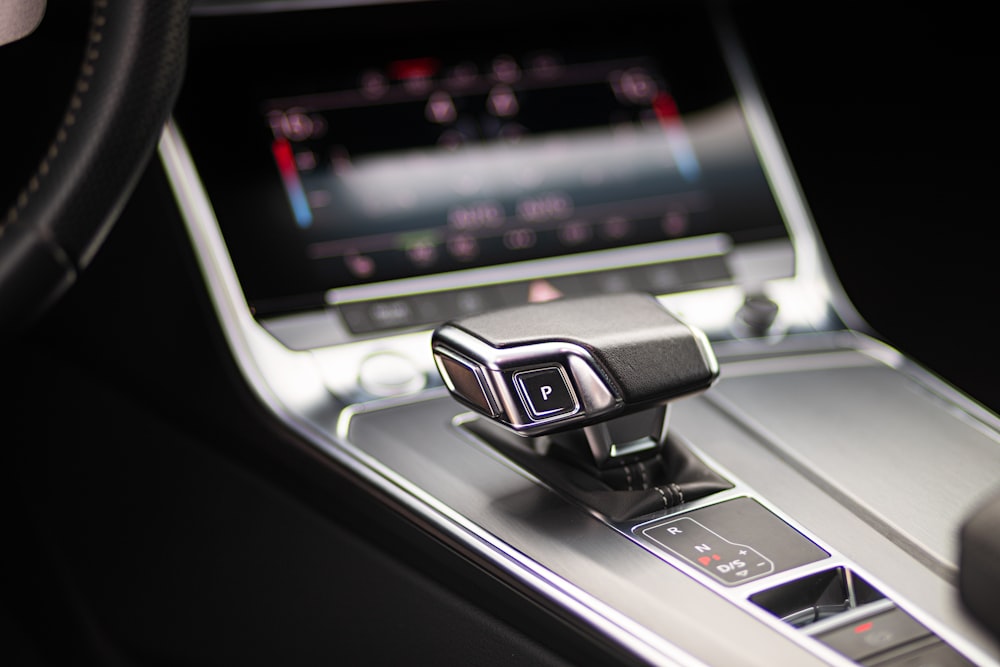 a close up of a car dashboard with a steering wheel