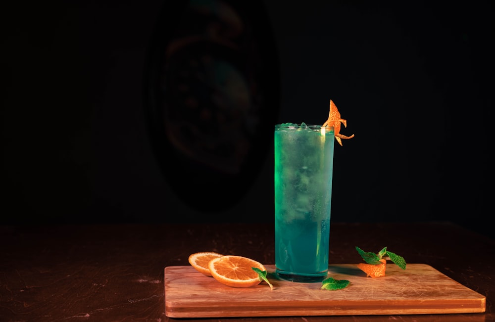 a blue drink with a garnish garnish garnish garn
