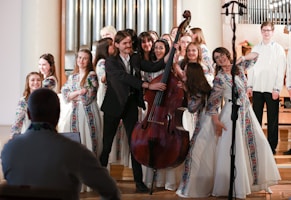 a group of people standing next to each other