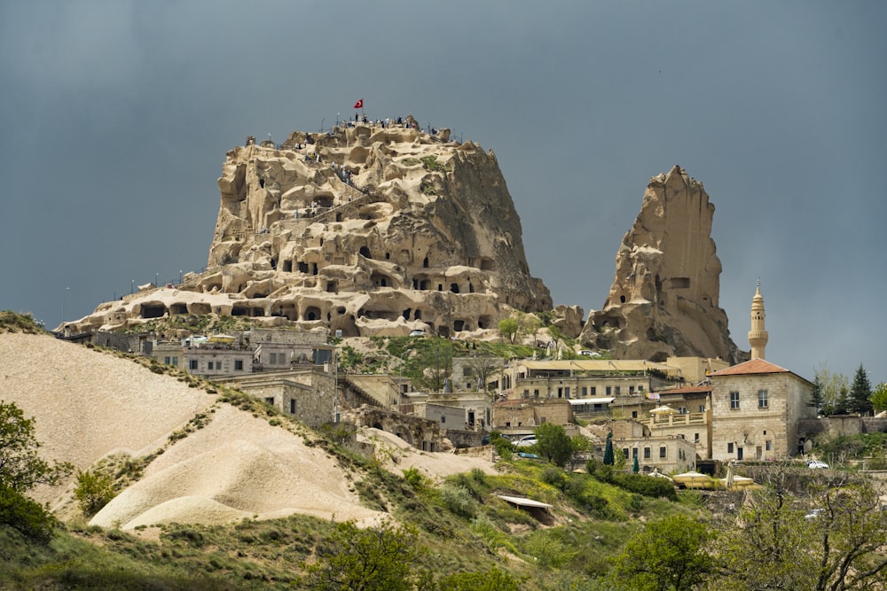 a large rock formation in the middle of a town