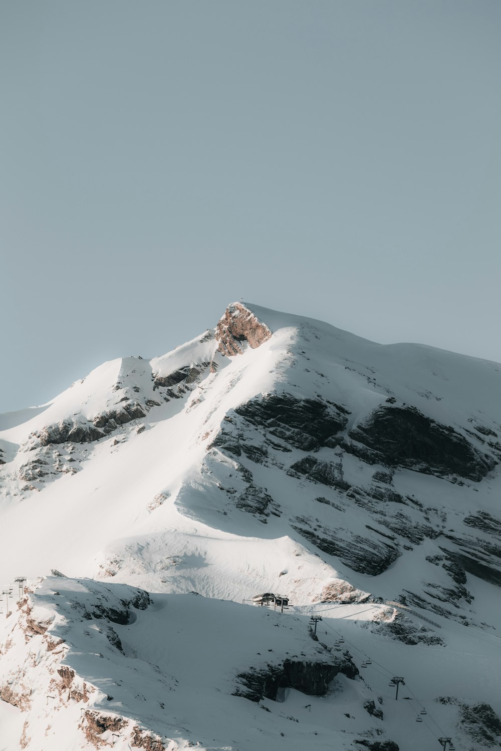 a snow covered mountain with a sky background