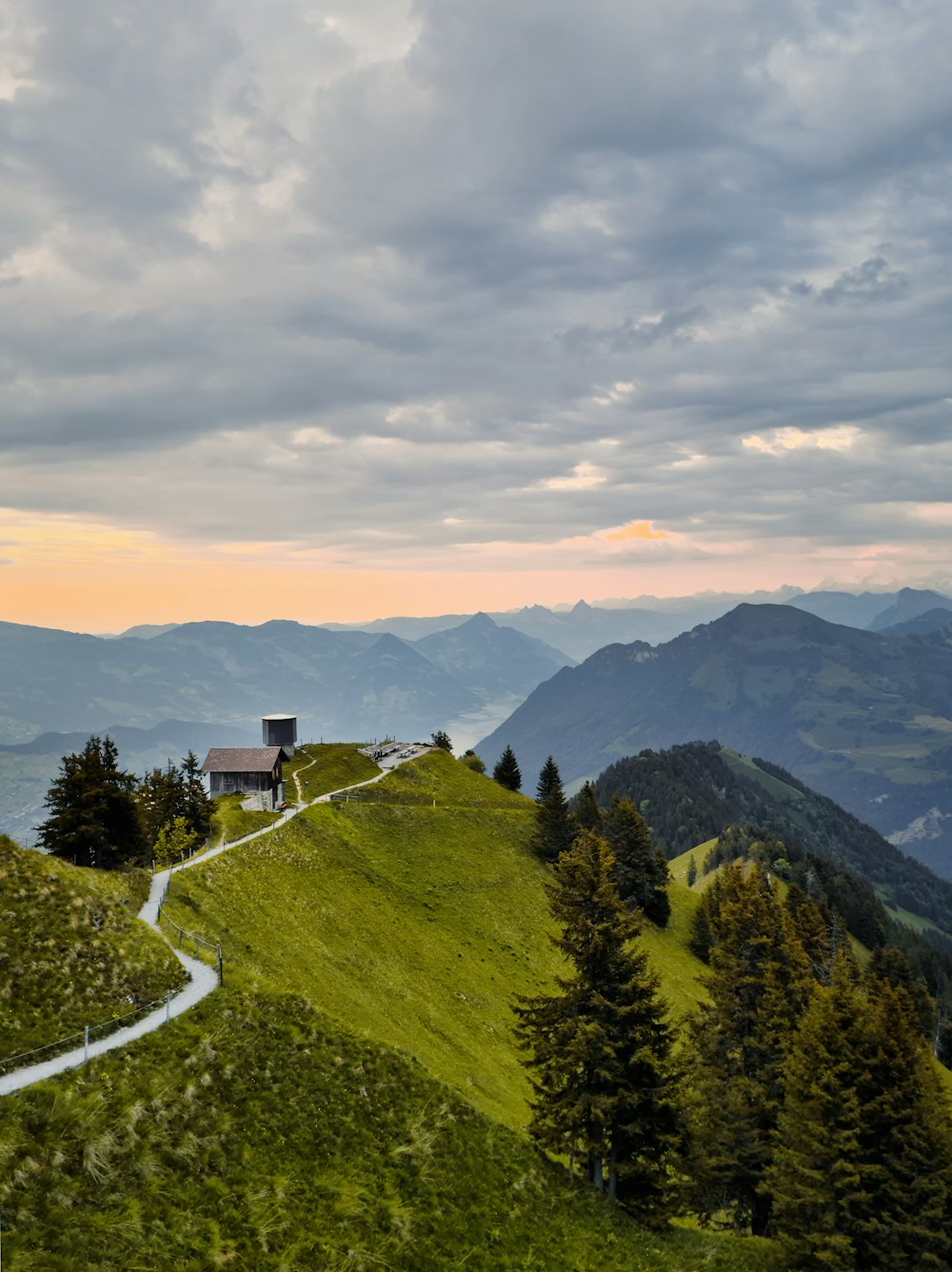 a house on top of a grassy hill