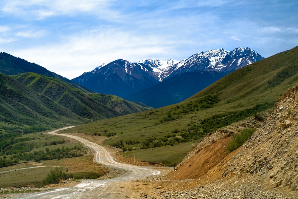 a dirt road in the middle of a mountain range