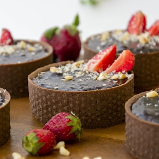 a close up of a dessert with chocolate and strawberries