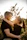 A happy couple embracing outdoors, looking hopeful and connected.