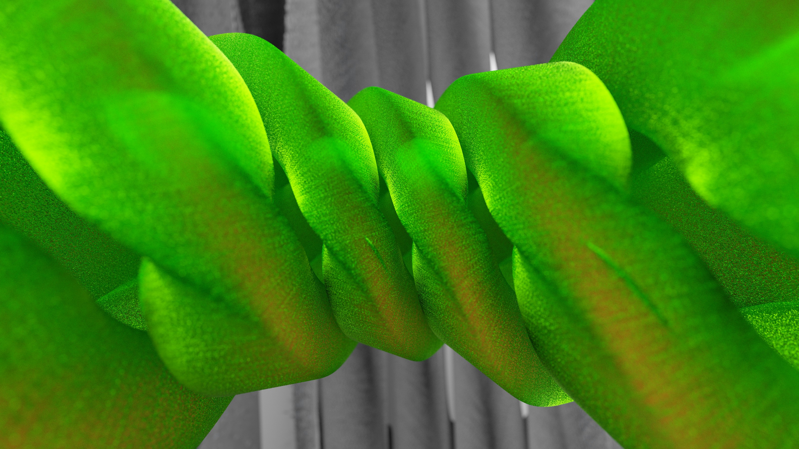 a close up of a green tie on a curtain