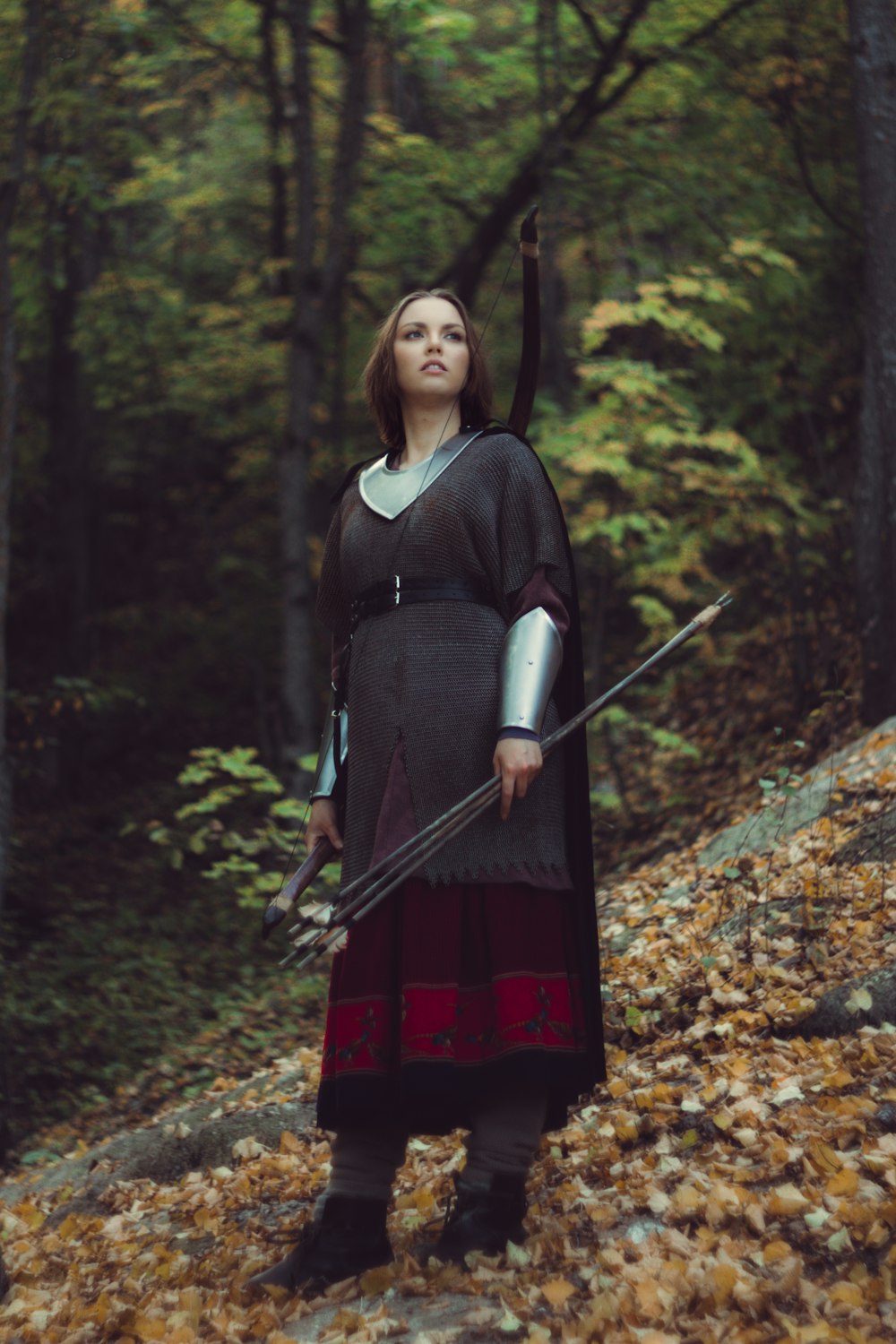 a woman dressed as a knight holding a sword