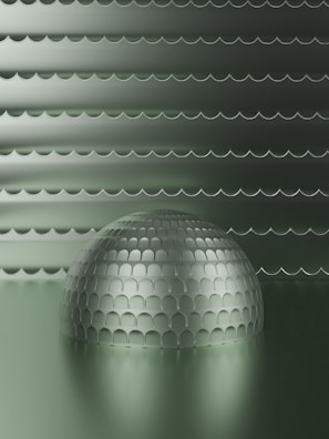 a shiny ball is sitting in the middle of a room