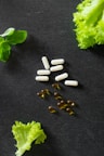 a bunch of pills sitting on top of lettuce